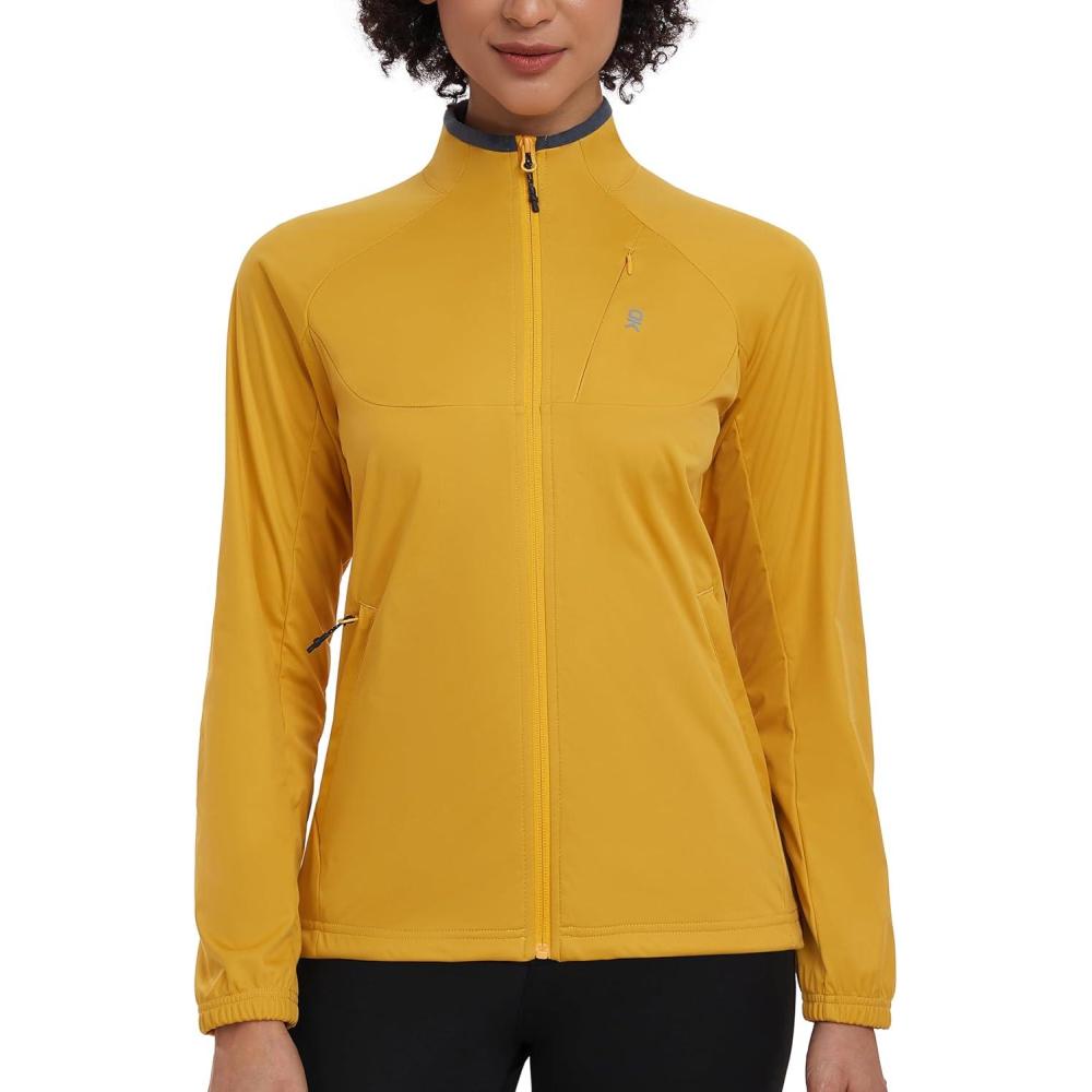 imageLittle Donkey Andy Womens Lightweight Softshell Jacket for Running Cycling Water Repellent Windbreaker with Zipper PocketsTurmeric